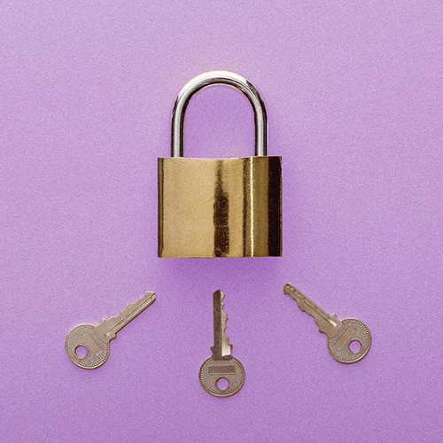 Three keys pointing to the keyhole on a padlock on a light purple background.