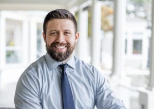 man in tie sitting in library