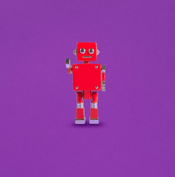 Red Robot isolated on a purple background.