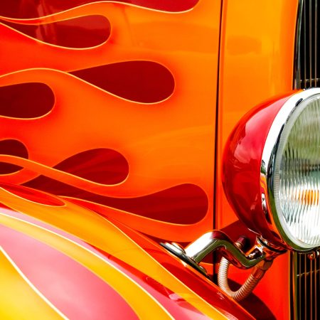 colorful flaming paintwork and headlamp on a custom hotrod