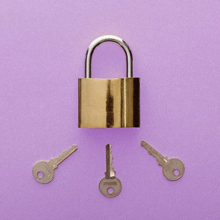 Three keys pointing to the keyhole on a padlock on a light purple background.